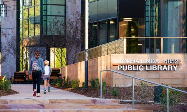 Two people walk into the newly opened Yorba Linda Library and Cultural Arts Center complex in Yorba Linda, Calif., on Nov. 30, 2020. (John Fredricks/The Epoch Times)