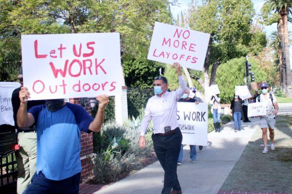 Protesters march outside the home of Mayor Eric Garcetti in Los Angeles on Dec. 8, 2020. (Jamie Joseph/The Epoch Times)