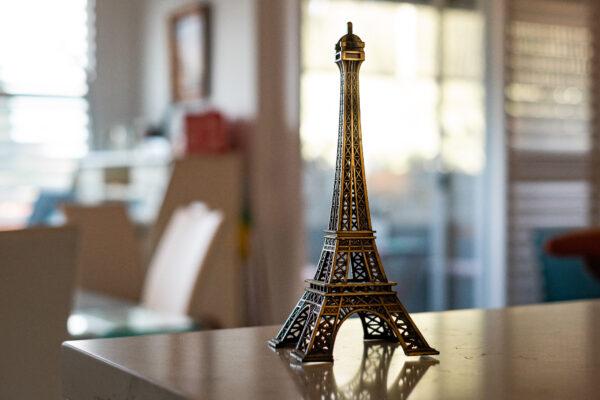 A small statue of the Eiffel Tower sits on the countertop of Elizabeth Sitton's kitchen at her home in Culver City, Calif., on Dec. 8, 2020. She traveled to France soon after escaping the marriage she entered at the age of 16. (John Fredricks/The Epoch Times)