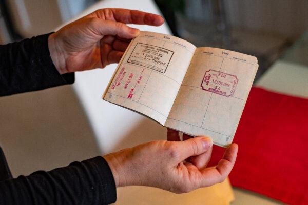 Elizabeth Sitton holds the passport she had at the time of her marriage when she was 16, at her home in Culver City, Calif., on Dec. 8, 2020. (John Fredricks/The Epoch Times)