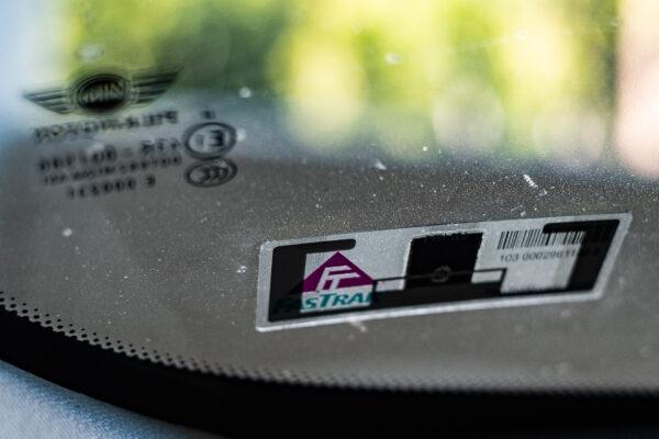 A FasTrak toll road pass on a car windshield in Irvine, Calif., on Dec. 17, 2020. (John Fredricks/The Epoch Times)