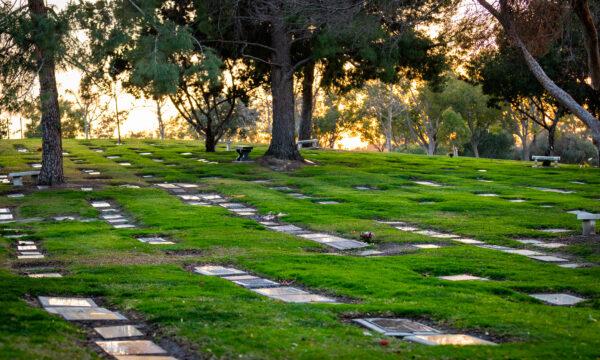 The sun sets behind a graveyard in Lake Forest, Calif., on Jan. 8, 2021. (John Fredricks/The Epoch Times)