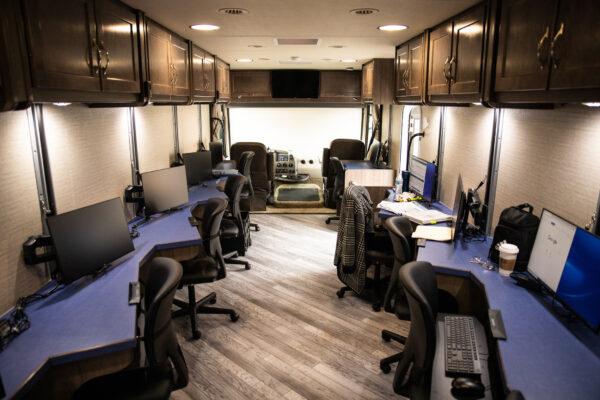 A County of Orange business and employment services bus parks for the day for scheduled appointments at the Rossmoor Library in Rossmoor, Calif., on Feb. 9, 2021. (John Fredricks/The Epoch Times)
