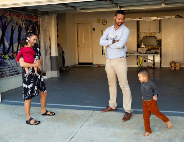 Azerone Perkins and his family stand in front of the garage where he roasts coffee beans in Trabuco Canyon, Calif., on Feb. 5, 2021. (John Fredricks/The Epoch Times)