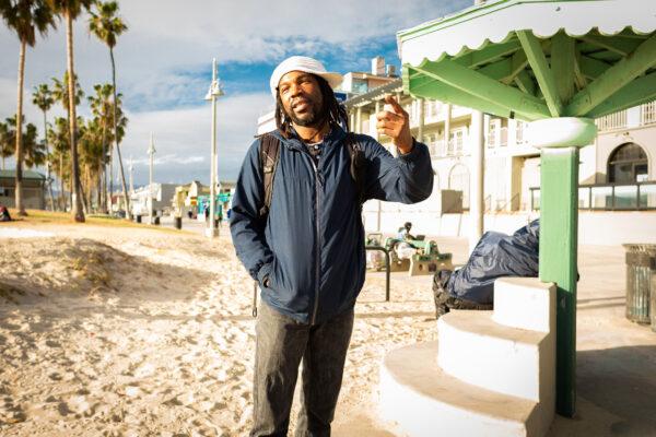 A homeless man named Pat stands on Venice Beach in Los Angeles on Jan. 27, 2021. (John Fredricks/The Epoch Times)