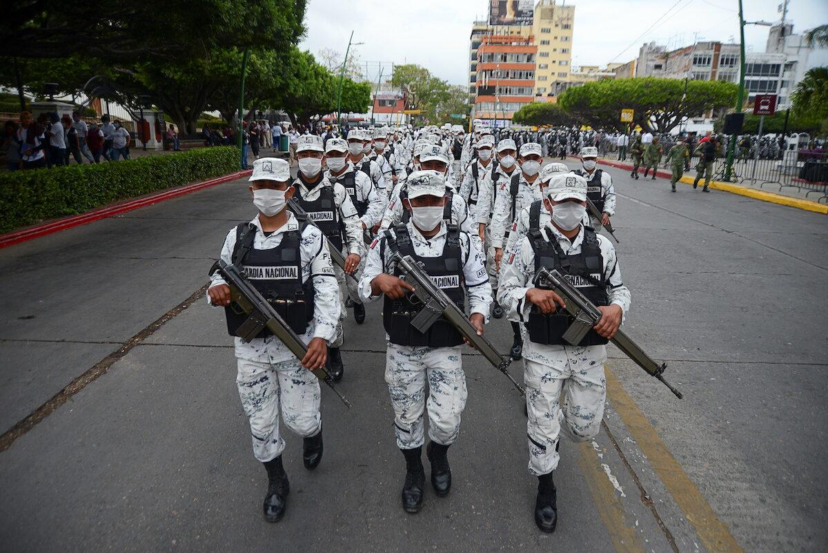 Members of the National Guard march during the announcement of the new measures by the Mexican government to deter illegal crossings at the southern border with Guatemala, in Tuxtla Gutierrez, Mexico, on March 19, 2021. (Jacob Garcia/Reuters)