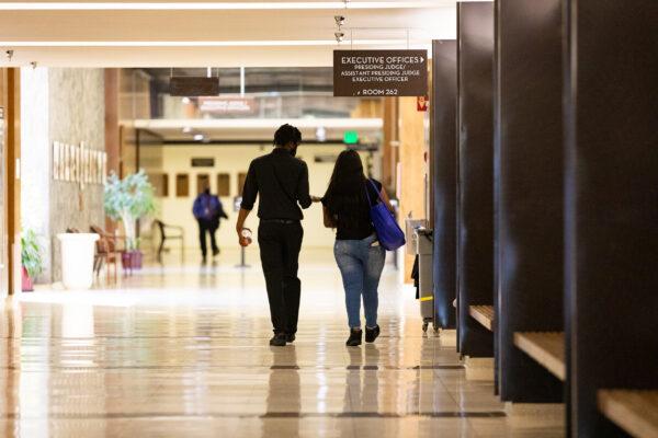 Zamire Kimball and an associate exit the Orange County Central Justice Center after his charges were dismissed, in Santa Ana, Calif., on Sept. 18, 2020. (John Fredricks/The Epoch Times)
