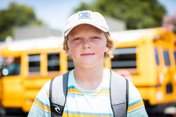 Ezra Nelson stands in front of Hewes Middle School in Santa Ana, Calif., on Aug. 2, 2021. (John Fredricks/The Epoch Times)