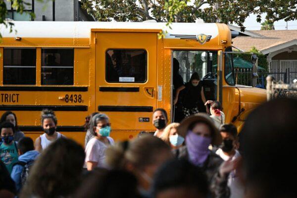 Students and parents arrive masked for the first day of the school year at Grant Elementary School in Los Angeles on Aug. 16, 2021. (Robyn Beck/AFP via Getty Images)