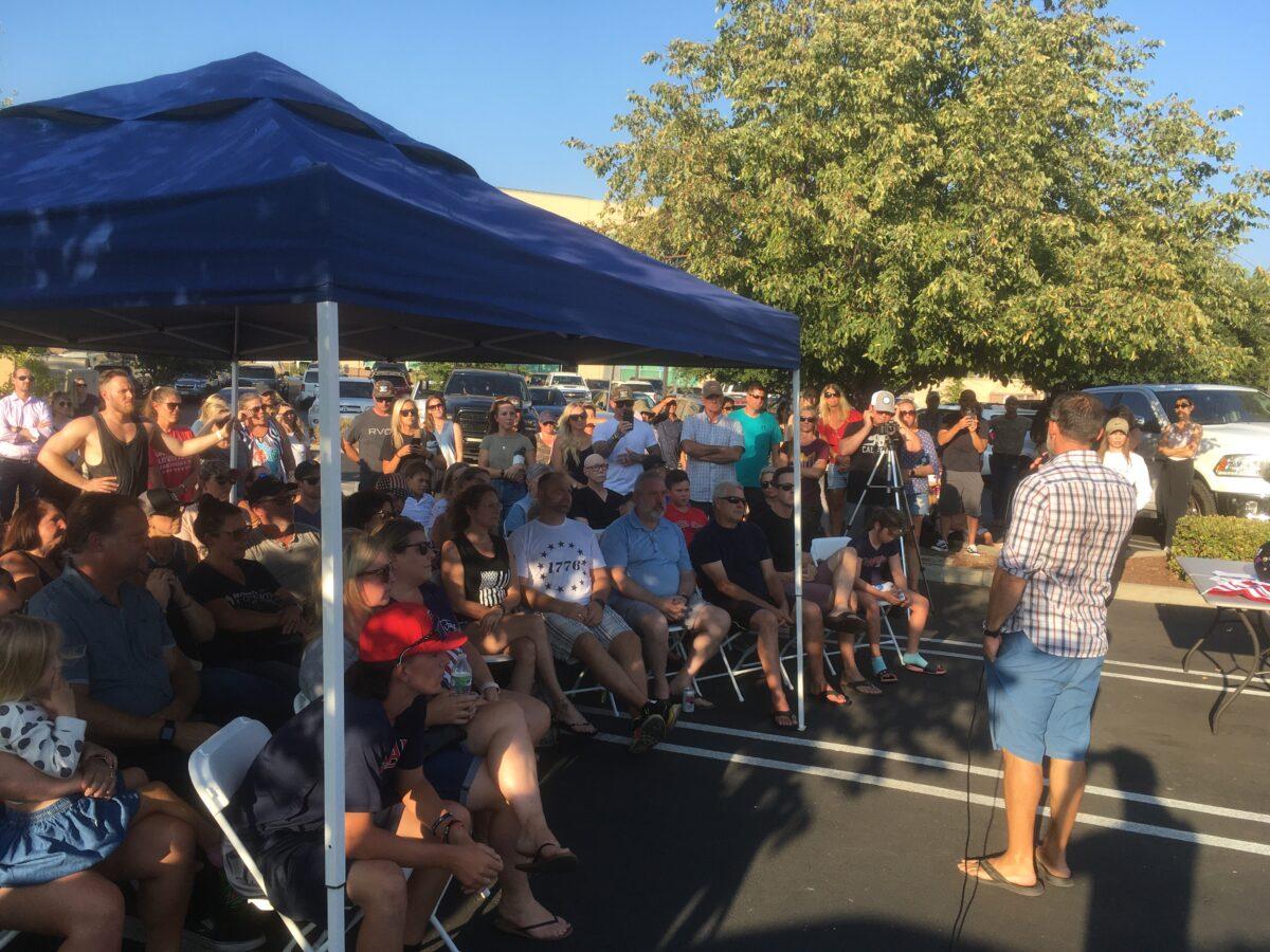 Parents rally outside Dr. Michael Huang’s office in Roseville, Calif. on Aug. 16, 2021 to support his efforts to provide medical exemptions to patients for masks and vaccines. (Courtesy Michael Huang)