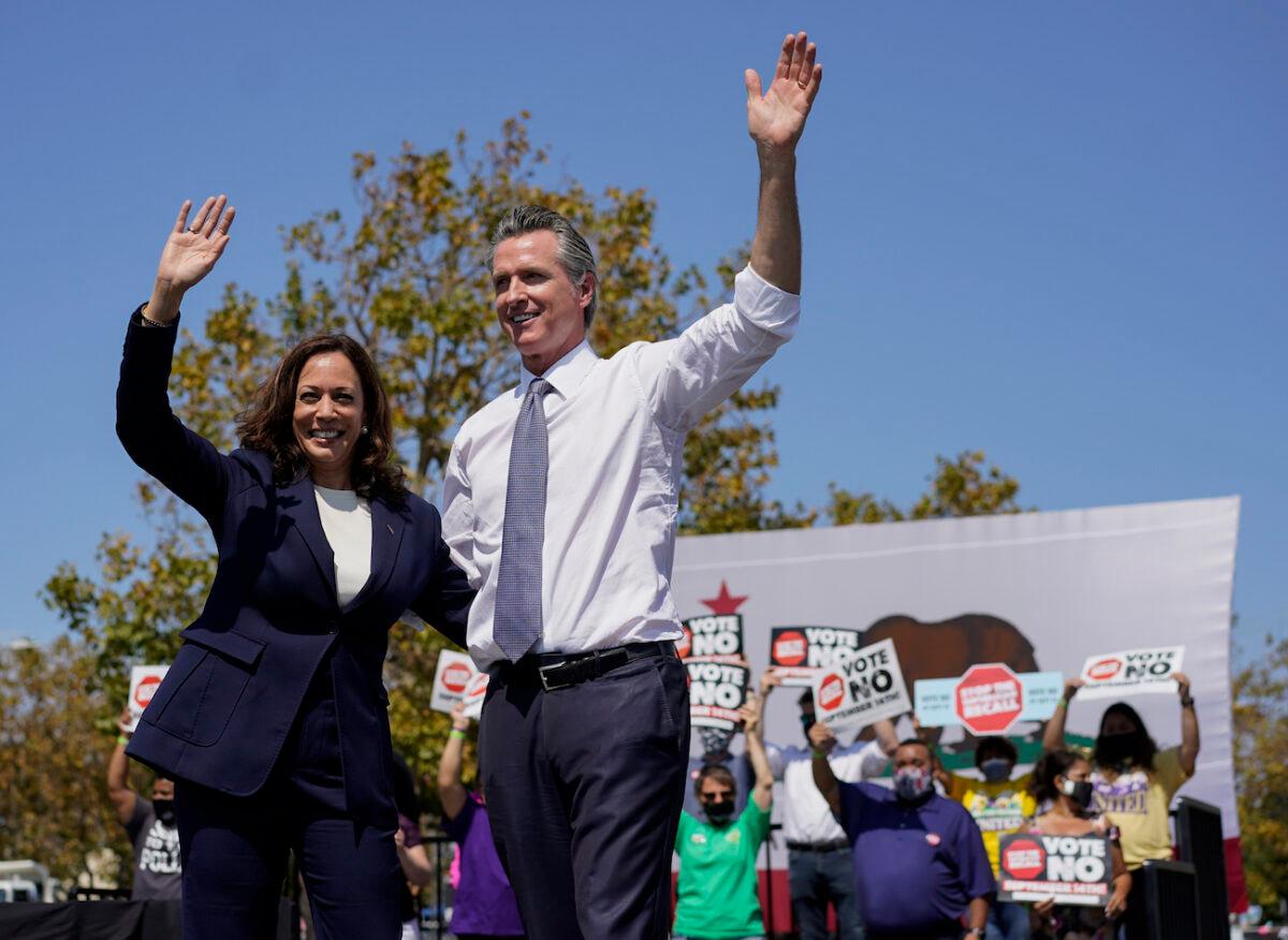 Vice President Kamala Harris stands on stage with California Gov. Gavin Newsom at the conclusion of an event at the IBEW-NECA Joint Apprenticeship Training Center in San Leandro, Calif., Sept. 8, 2021. (Carolyn Kaster/AP Photo)