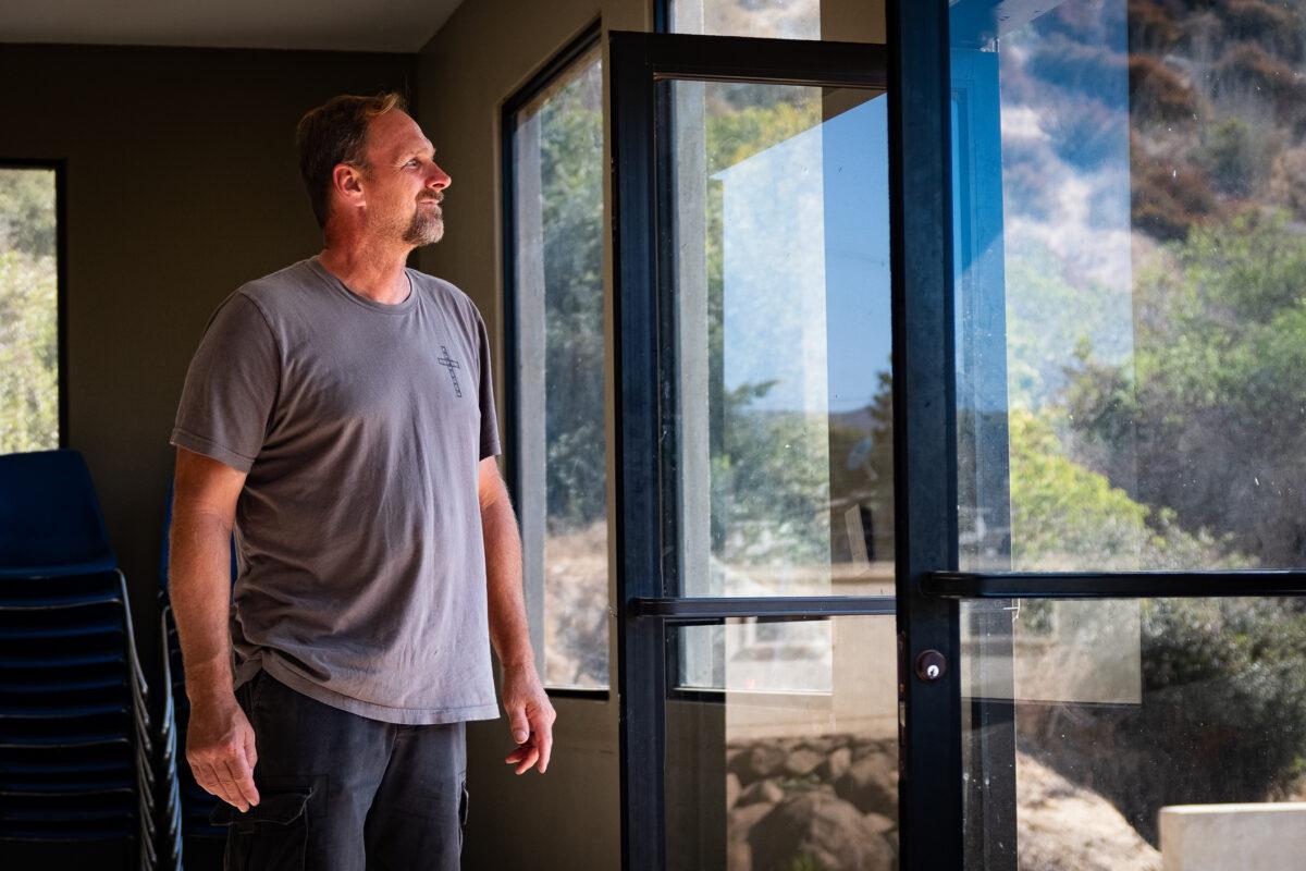 Rob Lortz looks upon the property of Ranch Libertad on Sept. 11, 2021. (John Fredricks/The Epoch Times)