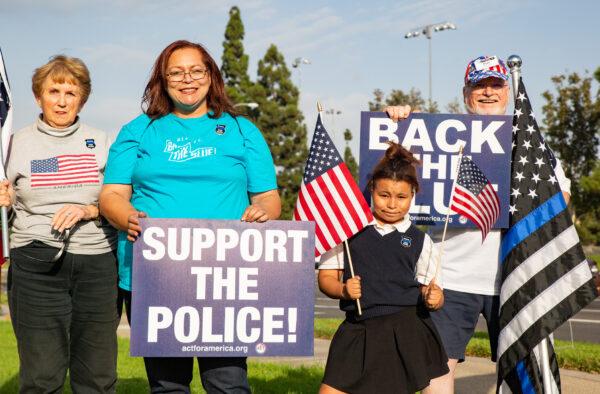 A small group Orange County locals gathered to show support for law enforcement and America in Irvine, Calif., on Oct. 11, 2021. (John Fredricks/The Epoch Times)