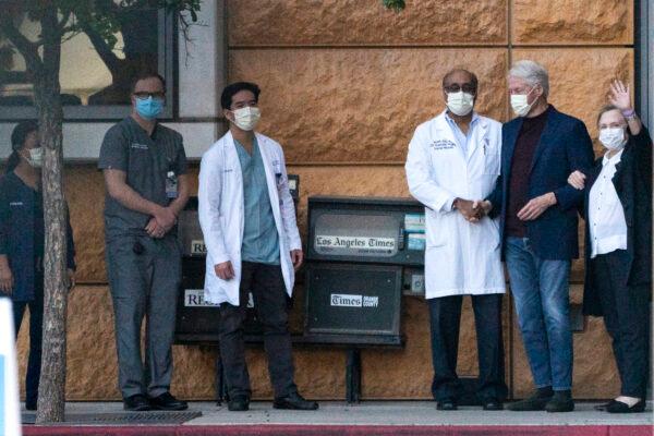 Former President Bill Clinton and former First Lady Hillary Clinton thank the medical staff as he is released from the University of California–Irvine Medical Center in Orange County, Calif., on Oct. 17, 2021. (Damian Dovarganes/AP Photo)