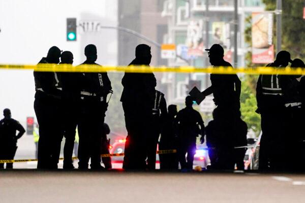 In this file photo, emergency crews work at the scene of an accident, in San Diego on March 15, 2021. (Gregory Bull/AP Photo)