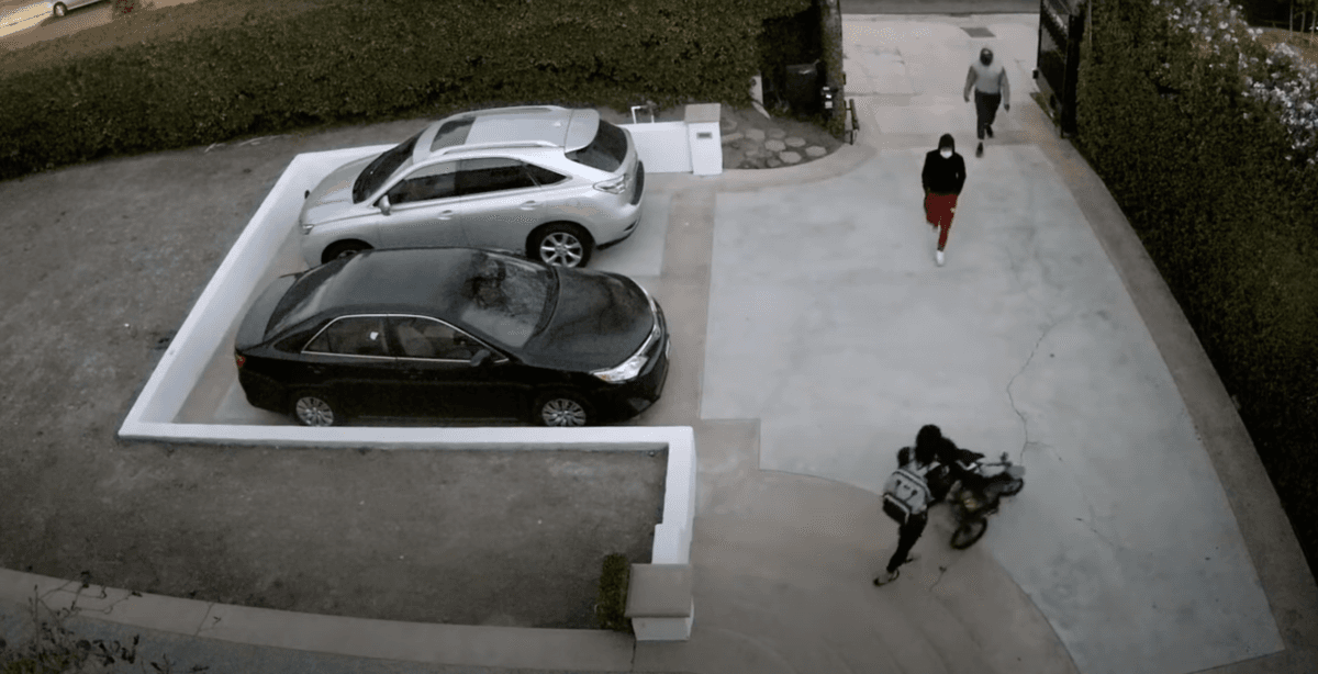 A screenshot of security footage of a daytime robbery in Hancock Park, Calif., on Nov. 28, 2021. (Courtesy of the Los Angeles Police Department)