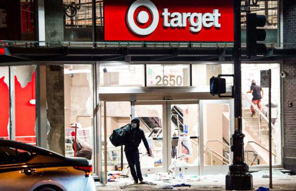 A looter robs a Target store in Oakland, Calif., on May 30, 2020. (Josh Edelson/AFP via Getty Images)
