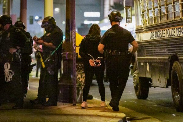 Los Angeles Police Department officers respond to an unlawful assembly in downtown Los Angeles on Nov. 3, 2020. (John Fredricks/The Epoch Times)