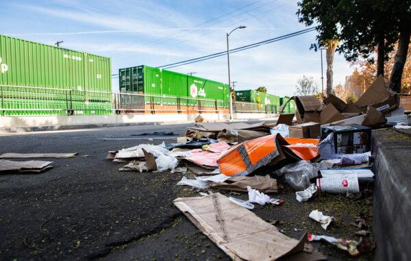 Empty boxes lie scattered near the railroad tracks after ongoing train robberies in the Lincoln Heights neighborhood of Los Angeles on Jan. 14, 2022. (John Fredricks/The Epoch Times)