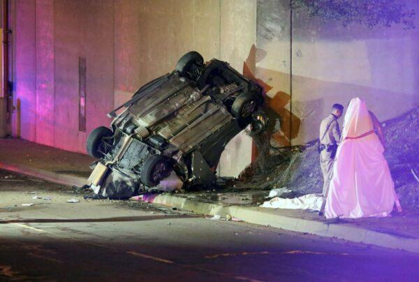California Highway Patrol officers work at the scene of a fatal accident after the vehicle plunged off an elevated section of Interstate 210 landing below on Michillinda Ave., in Pasadena, Calif., on Jan. 16, 2022. (James Carbone/AP Photo)