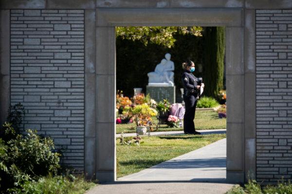 Los Angeles Police Department (LAPD) and Los Angeles Sheriff's Department officers pay respects at the memorial service of LAPD Officer Fernando Arroyos in Los Angeles on Feb. 2, 2022. (John Fredricks/The Epoch Times)