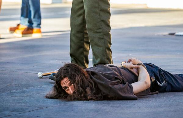 A man is arrested by a Sheriff's Deputy in Yucaipa, Calif., on Aug. 1, 2020. (John Fredricks/The Epoch Times)