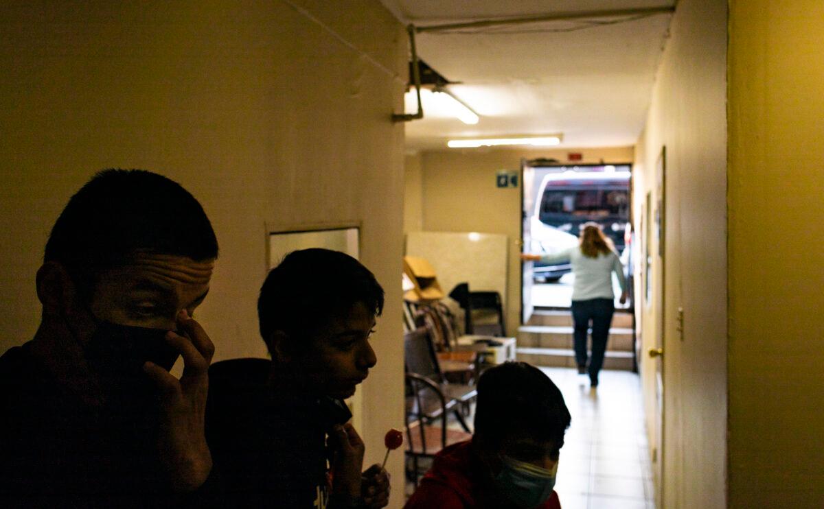 Children participating in Kids Club at Iglesia Cristiana Bethel look down the exit leading to the streets of Zona Norte in Tijuana, Mexico, on Feb. 5, 2022. (John Fredricks/The Epoch Times)