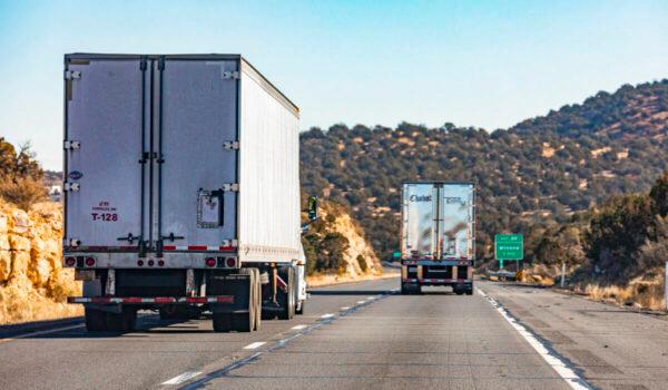 Semi trucks pass through the state of Arizona on Dec. 3, 2021. (John Fredricks/Epoch Times)