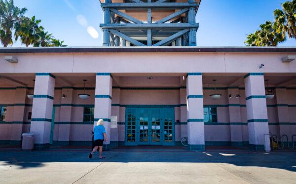A woman enters the Abbot Kinney Memorial Branch Library in Venice, Calif., on Feb. 18, 2022. (John Fredricks/The Epoch Times)