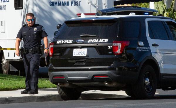 Police officers secure a crime scene in Irvine, Calif., on May 5, 2021. (John Fredricks/The Epoch Times)
