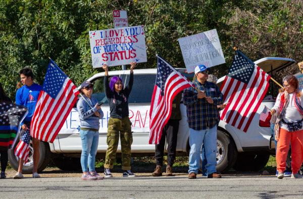 People gather in El Monte, Calif., to show support for truckers partaking in a convoy from Los Angeles to Washington D.C, in protest of coronavirus mandates on Feb. 25, 2022. (John Fredricks/The Epoch Times)