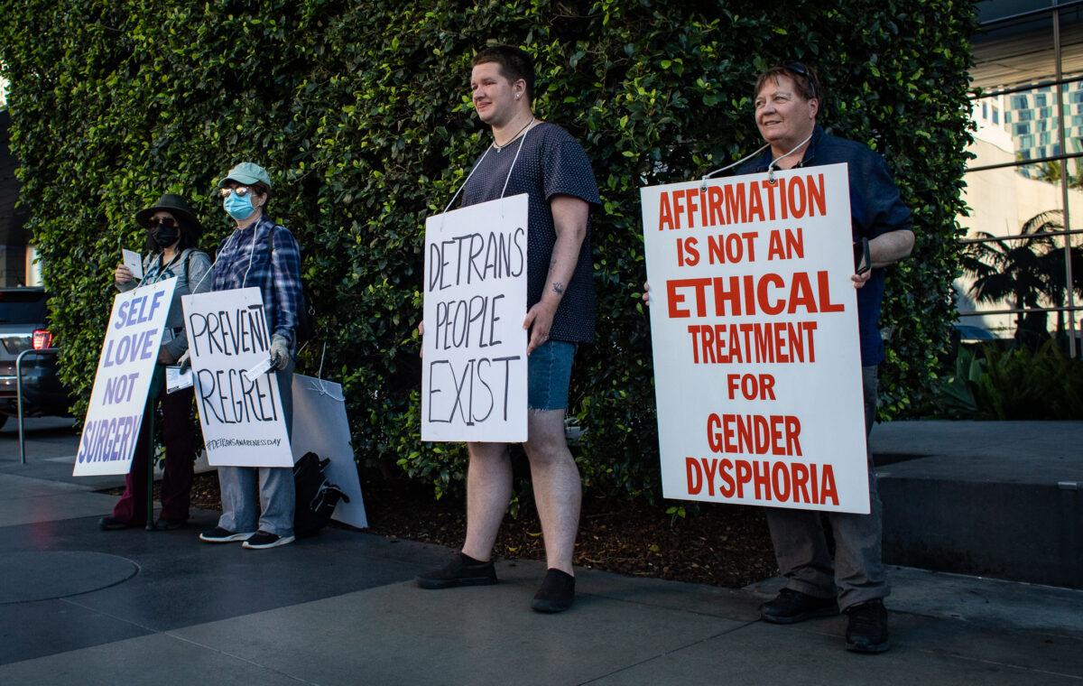 Demonstrators share about Detransition Awareness Day in Los Angeles on March 12, 2022. (John Fredricks/The Epoch Times)