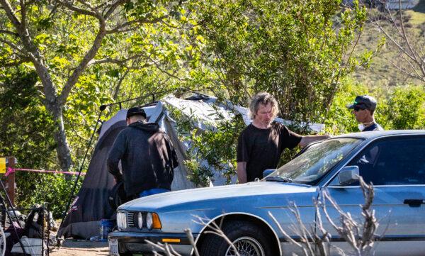 A homeless encampment of vehicles lines Jefferson along Ballona Creek in Playa Del Rey, Calif., on Feb. 18, 2022. (John Fredricks/The Epoch Times)