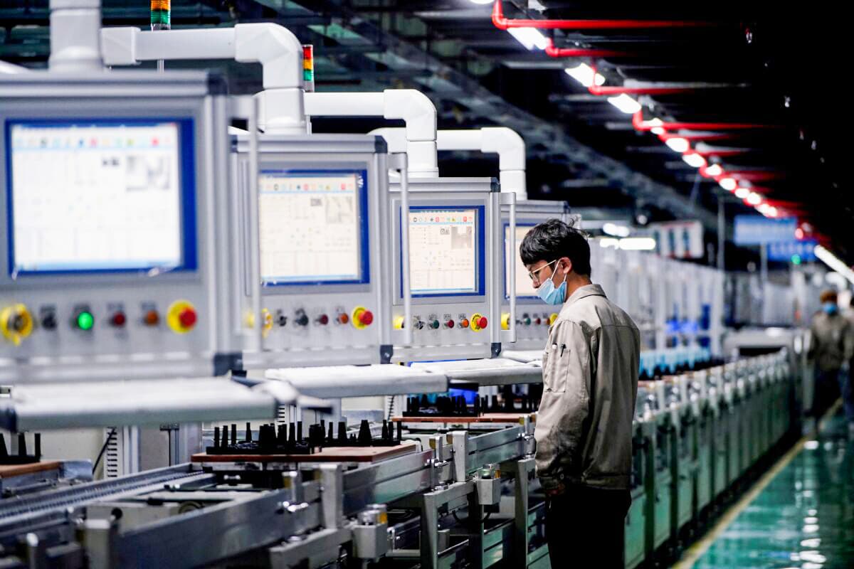 An employee works on the production line of electric vehicle (EV) battery manufacturer Octillion in Hefei, Anhui Province, China, on March 30, 2021. (Aly Song/Reuters)