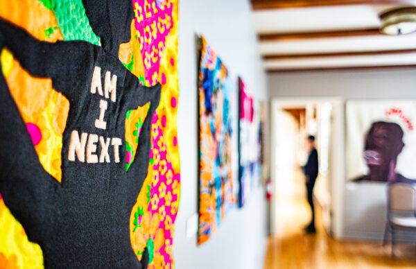 Artist Allyson Allen displays her quilting artwork along the walls of Laguna Friendship Church in Laguna Beach, Calif., on April 1, 2022. (John Fredricks/The Epoch Times)