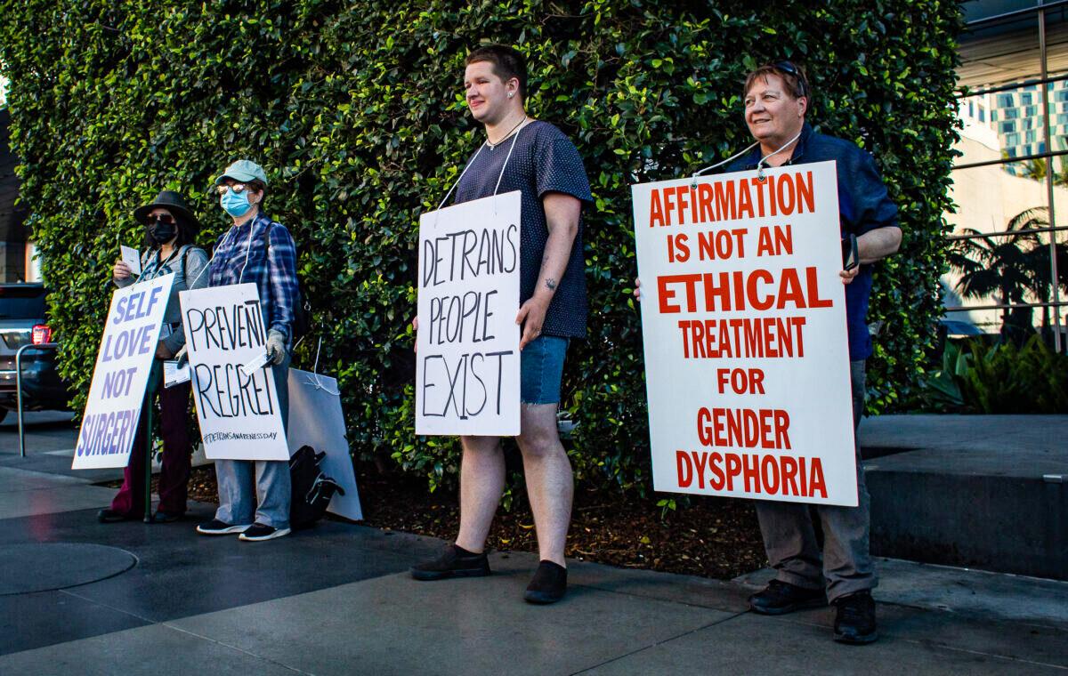 Demonstrators share about Detransition Awareness Day in Los Angeles on March 12, 2022. (John Fredricks/The Epoch Times)