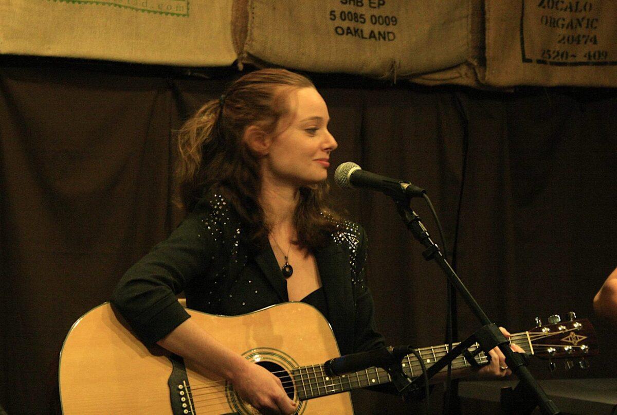 Cat performing onstage. (Courtesy of Cat Cattinson)