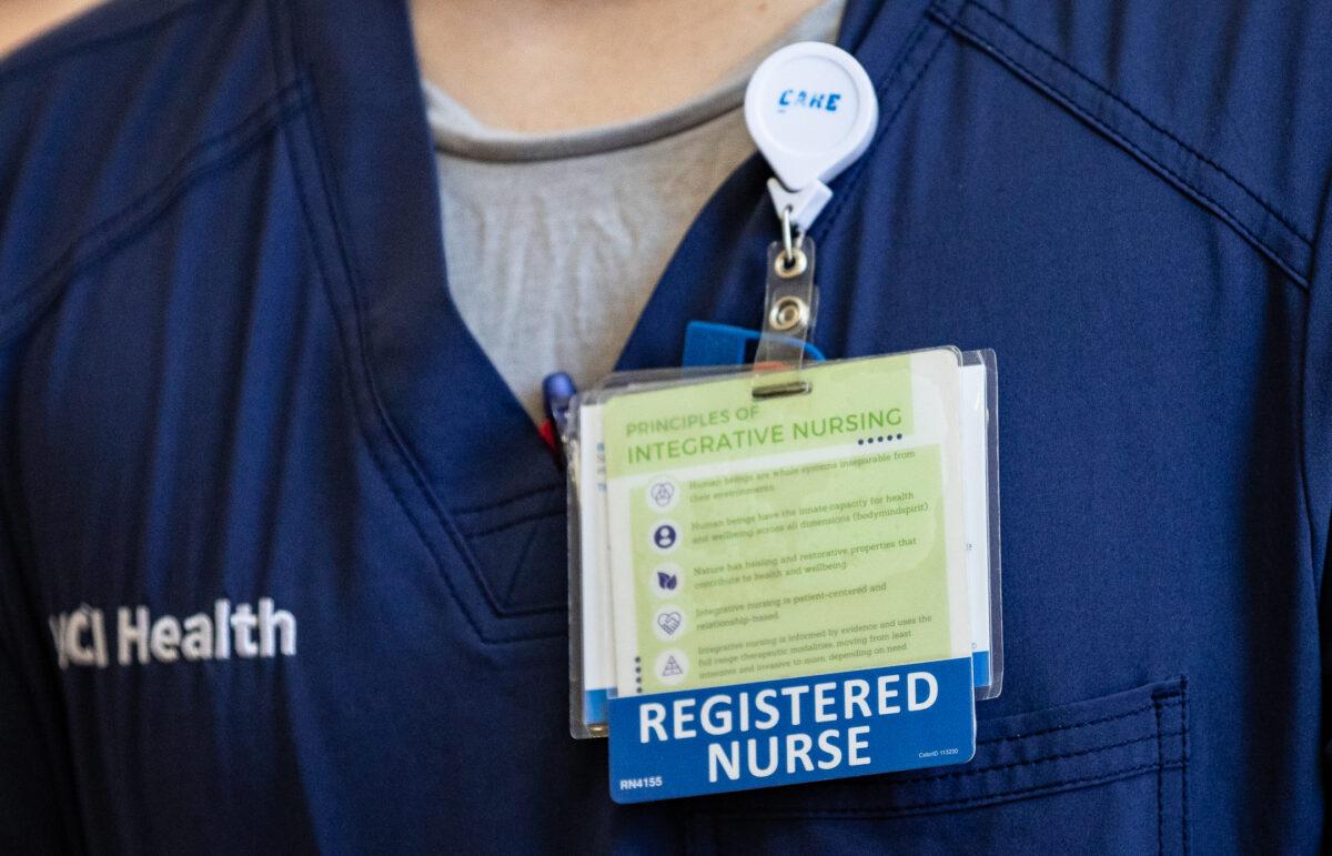 A nurse wears an identification tag at UCI Medical Center in Orange, Calif., on April 13, 2022. (John Fredricks/The Epoch Times)