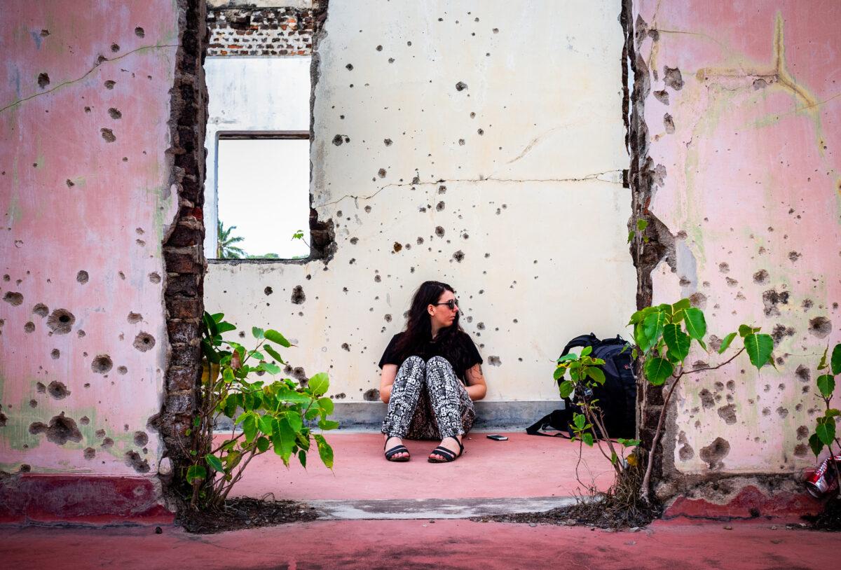 Tali Miles sits in the former Jaffna train station in Jaffna, Sri Lanka, on Oct. 12, 2013. (John Fredricks/The Epoch Times)