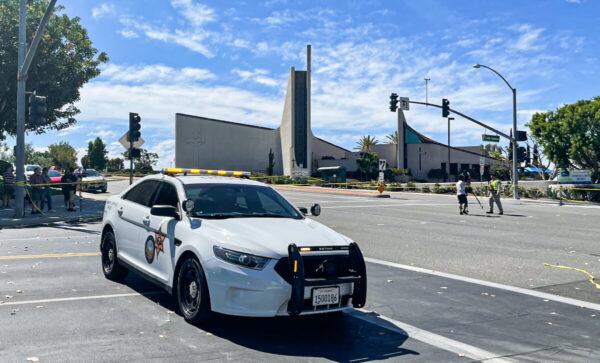 An Orange County Sheriff's Department car is parked outside of Geneva Presbyterian Church after a shooting left one dead and four critically injured in Laguna Woods, Calif., on May 15, 2022. (Vanessa Serna/The Epoch Times)