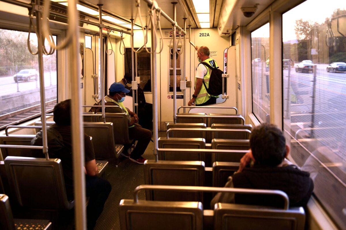 Transit passengers ride the Metro C Line in Los Angeles on July 16, 2021. (Patrick T. Fallon/AFP via Getty Images)