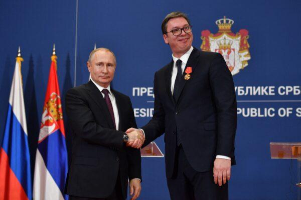 Russian President Vladimir Putin decorates Serbian President Aleksandar Vucic with the Alexander Nevsky Order following a signing ceremony after their talks in Belgrade, Serbia, on Jan. 17, 2019. (Andrej Isakovic/AFP via Getty Images)