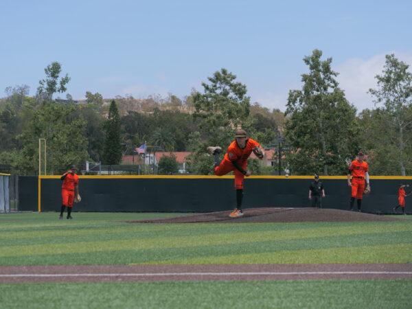 Starting pitcher, Matthew Lopez, warms up before his final seven shut-out innings for Huntington Beach High School's first CIF Southern California Regional Championship win at JSerra baseball field, in San Juan Capistrano, Calif., on June 4, 2022. (Nhat Hoang/The Epoch Times)