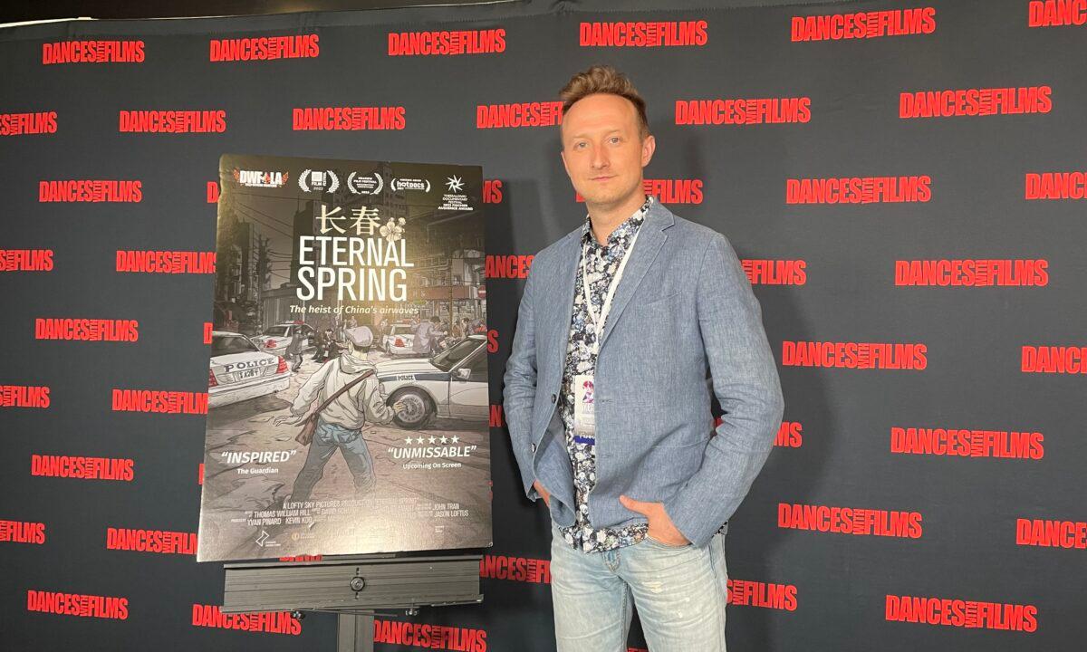 Jason Loftus, director of the award-winning documentary "Eternal Spring" poses for photographs at the Southern California premiere of the film at the Chinese Theatre in Hollywood, Los Angeles, on June 15, 2022. (Alice Sun/The Epoch Times)