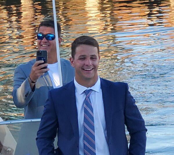 Brock Purdy, and his father, Shawn Purdy (former Angels minor league baseball player), arrive at dock, escorted by an Orange County Sheriff's boat for the Mr. Irrevelent Toast & Roast at The Cannery restaurant in Newport Beach, Calif., on June 20, 2022. (Nhat Hoang/The Epoch Times)