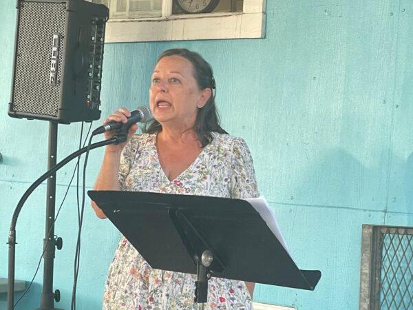 Volunteers speak on stage at Mary's Kitchen's final banquet to celebrate their memories of serving homeless people in the community in Orange, Calif., on July 10, 2022. (Carol Cassis/The Epoch Times)