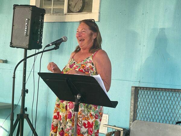 Volunteers speak on stage at Mary's Kitchen's final banquet to celebrate their memories of serving homeless people in the community in Orange, Calif., on July 10, 2022. (Carol Cassis/The Epoch Times)
