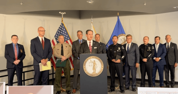 Orange County District Attorney Todd Spitzer (C) and other law enforcement officials speak about a plan to charge a Los Angeles man in connection with a deadly robbery spree at a half-dozen 7-Elevens and a doughnut shop at a news conference in Santa Ana, Calif., on July 18, 2022. (Screenshot via Facebook/Orange County District Attorney Todd Spitzer)