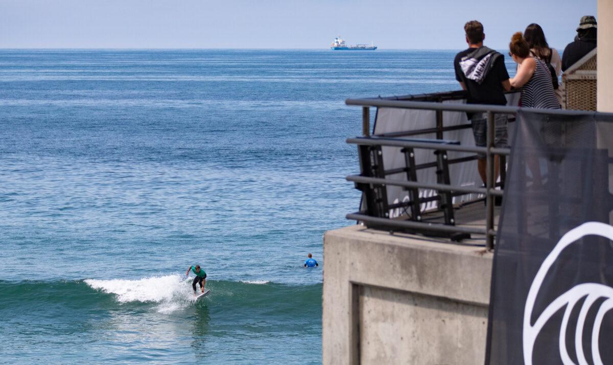 Thousands of people gather for the opening day of the Vans US Open of Surfing in Huntington Beach, Calif., on July 30, 2022. (John Fredricks/The Epoch Times)