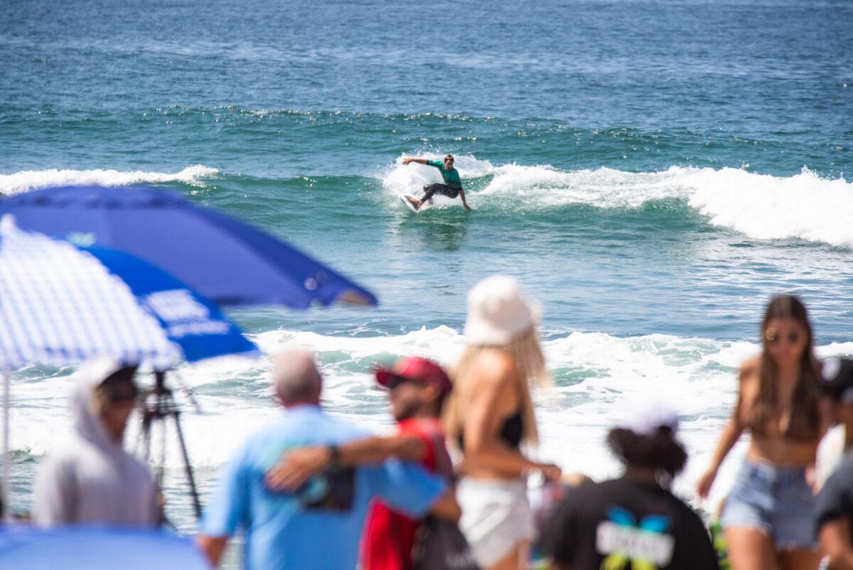 Thousands of people gather for the opening day of the U.S. Open of Surfing in Huntington Beach, Calif., on July 30, 2022. (John Fredricks/The Epoch Times)